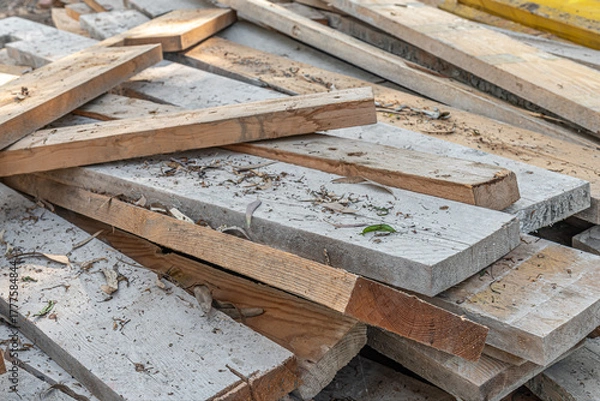 Fototapeta abstract background of pile of wooden construction debris on the ground close up