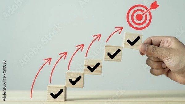Fototapeta Hand placing final checkmark on steps leading to a bullseye target, symbolizing goal achievement and success.
