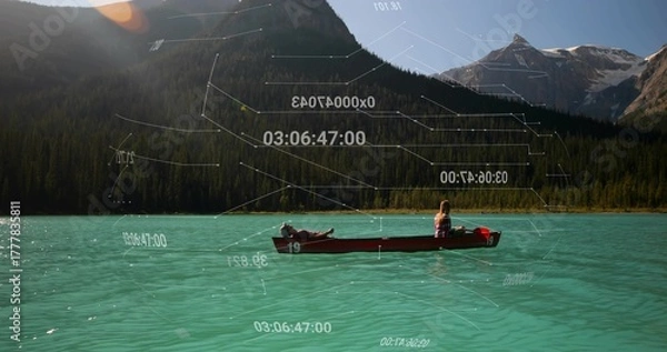 Fototapeta Floating couple in red canoe gliding on turquoise lake in pine valley, with overlays, life vest