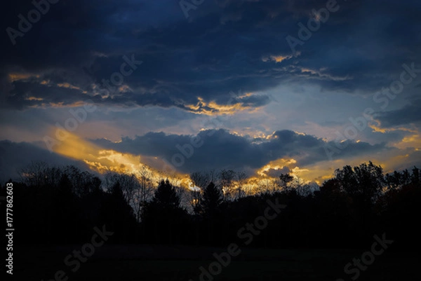 Fototapeta Sun Beams through the Clouds
