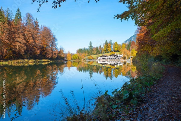 Fototapeta peaceful scenery lake Riessersee in autumn. hiking destination with restaurant