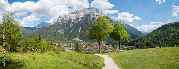 Fototapeta recreational place above Mittenwald, with bench and pilgrimage cross. Karwendel mountains.