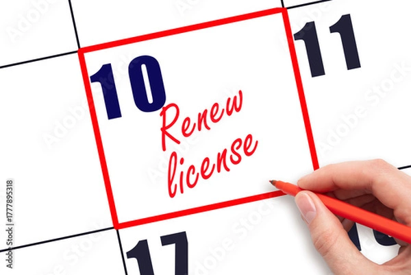 Fototapeta 10 th day of the month.  Hand writing Renew license reminder and drawing red frame on calendar with red pen on white background. Business concept. Planning and scheduling