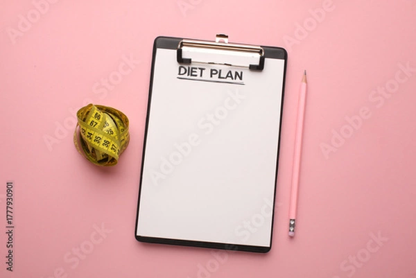 Obraz Making a meal plan for several days. Concept of healthy lifestyle, sports and daily routine. Notebook, marker, dumbbells, fruit healthy food, centimetre. Diet plan. Top view, horizontal.