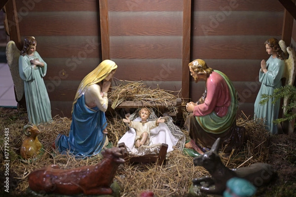 Fototapeta Traditional Christmas nativity scene with Mary and Joseph and baby Jesus in the manger.