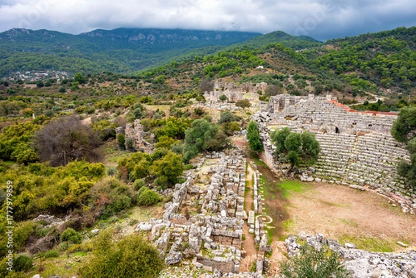 Fototapeta Kaunos (Carian: Kbid Lycian: Xbide Ancient Greek: Καῦνος; Latin: Caunus) ancient city was a city of ancient Caria and in Anatolia, a few kilometres west of the modern town of Dalyan. Amphitheatre area