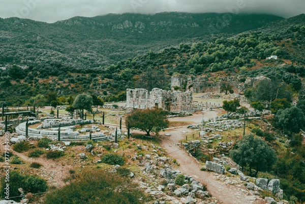 Fototapeta Kaunos (Carian: Kbid Lycian: Xbide Ancient Greek: Καῦνος; Latin: Caunus) ancient city was a city of ancient Caria and in Anatolia, a few kilometres west of the modern town of Dalyan. Amphitheatre area