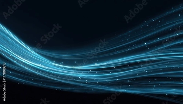 Obraz Abstract blue light trails and glowing particles against dark background