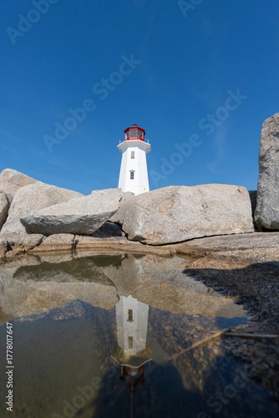 Fototapeta Peggys Cove, Canada - October 06, 2025: Peggys Point Lighthouse, also known as Peggys Cove Lighthouse, is an active lighthouse and an iconic Canadian image.
