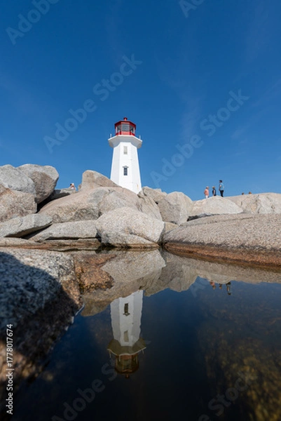 Fototapeta Peggys Cove, Canada - October 06, 2025: Peggys Point Lighthouse, also known as Peggys Cove Lighthouse, is an active lighthouse and an iconic Canadian image.