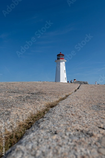Fototapeta Peggys Cove, Canada - October 06, 2025: Peggys Point Lighthouse, also known as Peggys Cove Lighthouse, is an active lighthouse and an iconic Canadian image.