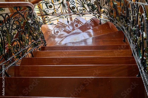 Obraz a teak wood stairs or staircase, Spiral teak steps inside a luxury house