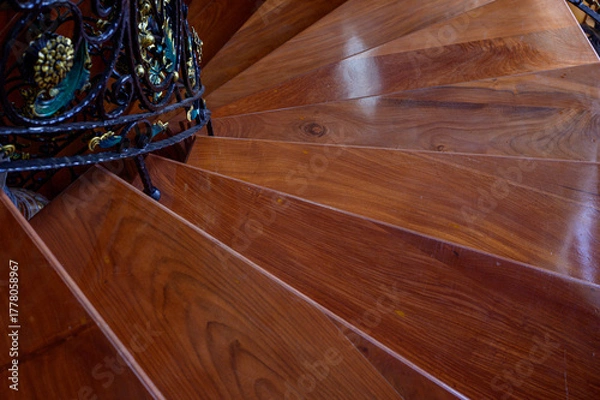 Obraz a teak wood stairs or staircase, Spiral teak steps inside a luxury house