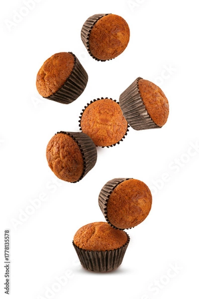 Obraz  Falling chocolate muffin isolated on white background.