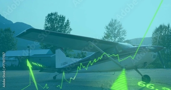 Fototapeta Showing high-wing propeller airplane parked on rural airstrip, with neon-green line graph overlay