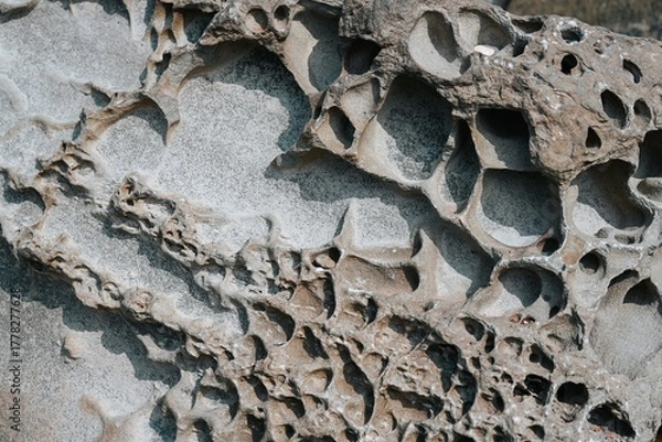 Fototapeta Closeup of porous volcanic rock texture at Desantnaya Bay in Vladivostok, Russia, ideal for natural background or geological copy space design.