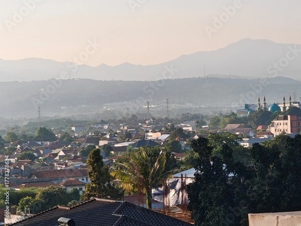 Obraz Peaceful Cityscape with Distant Mountains