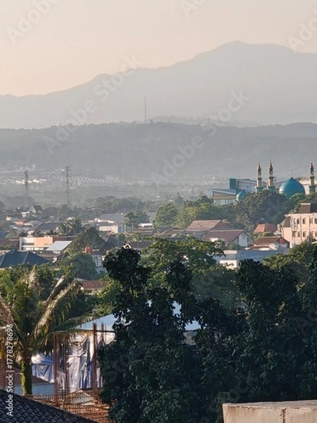 Obraz Peaceful Cityscape with Distant Mountains
