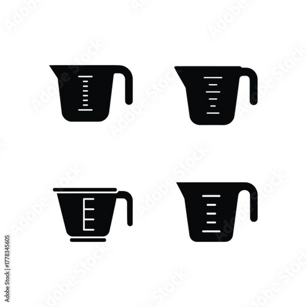 Fototapeta Collection of Measuring Cups with Metric and Imperial Measurements for Kitchen and Baking Needs