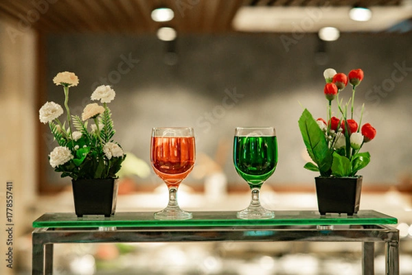 Obraz A table with drink and a flower