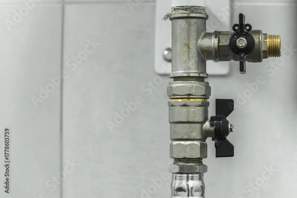 Fototapeta Close-up of water taps. Infrastructure and maintenance concept for safety and efficiency.