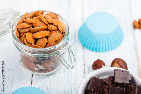 Fototapeta muffin baking ingredients on white wooden table