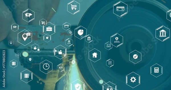 Obraz Grinding gloved hand holding workpiece against bench grinder wheel in workshop, with finance icons