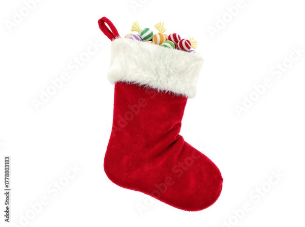 Obraz Classic red Christmas stocking with white fluffy trim and candy peeking out, isolated on white PNG background.