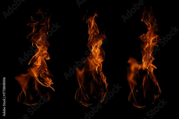 Fototapeta Blazing fire and glowing flames on a dark background perfect for creative design and visual effects.
