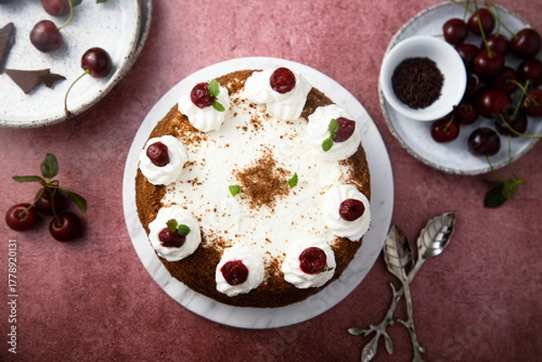 Fototapeta Chocolate cake with whipped cream and cherries