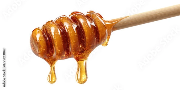 Fototapeta Golden honey dripping from a wooden dipper (2)