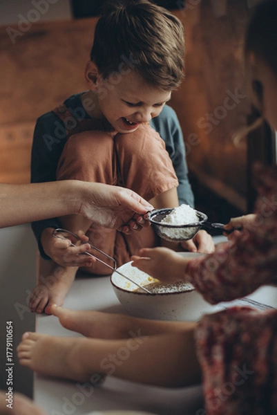 Obraz a little boy in the kitchen preparing food for the holiday