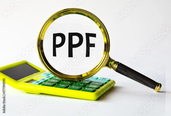 Fototapeta PPF - acronym under magnifying glass on the background of calculator