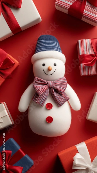 Fototapeta Holiday shopping. Snowman with wrapped gifts on red festive backdrop.