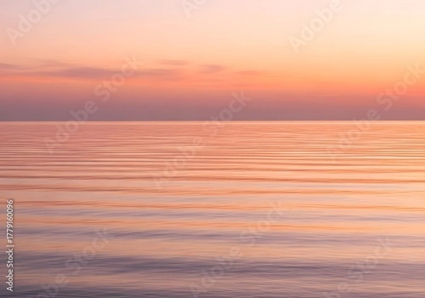 Fototapeta Pastel sunset over rippled sea horizon with soft gradient sky and horizontal bands