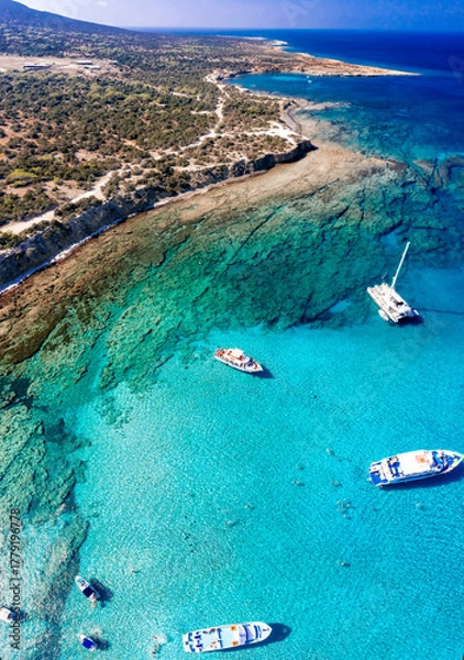 Fototapeta Aerial view of tourists swimming and enjoying the turquoise waters of Chrysochou bay in the blue lagoon, Akamas peninsula, Cyprus