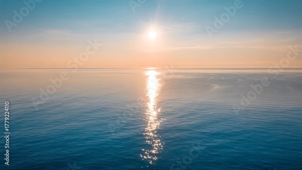 Fototapeta Tranquil Ocean Horizon with Golden Sun Reflection on Water Surface