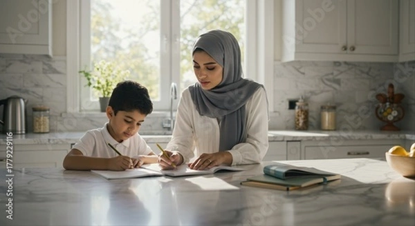 Obraz mother helps young son with homework at kitchen table on a sunny day