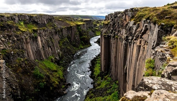 Obraz River flowing through a dramatic canyon