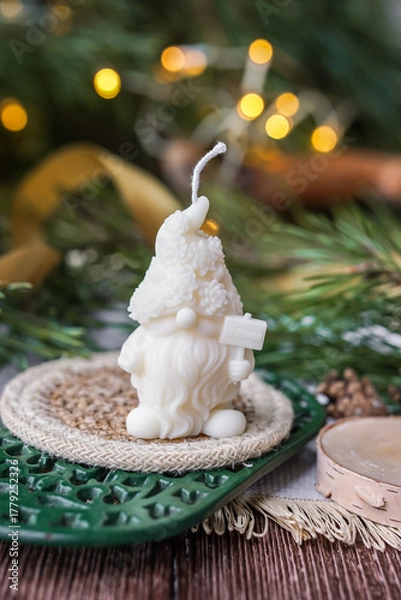 Fototapeta Handmade soy wax candles in the cozy room, Christmas lights in the background