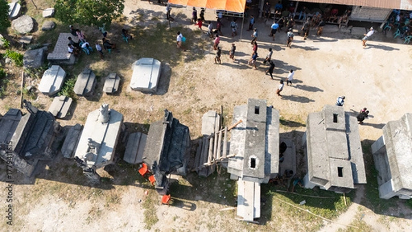 Fototapeta Megalithic graves made of large stones in Umabara Pau village,east sumba, seen from the air