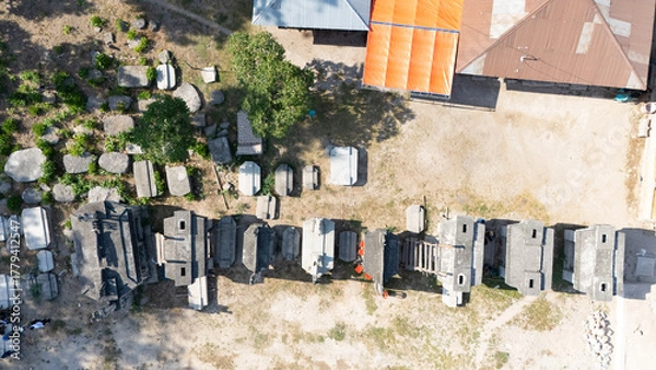 Obraz Megalithic graves made of large stones in Umabara Pau village,east sumba, seen from the air. 
