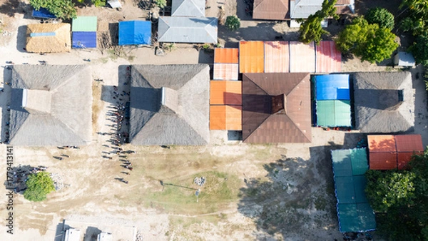 Obraz Ahead of the funeral of the King of Pau, the arriving family expressed their condolences, walking among the megalithic grave stones 