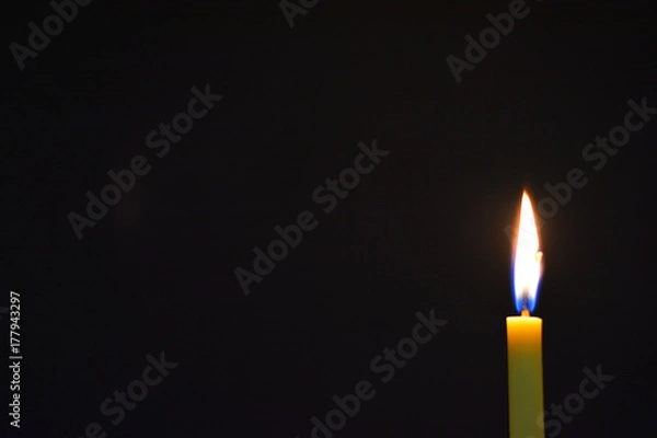 Obraz Candle light with dark background.