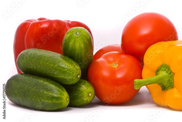Fototapeta Fresh tomatoes, cucumbers and pepper on a studio white backgroun