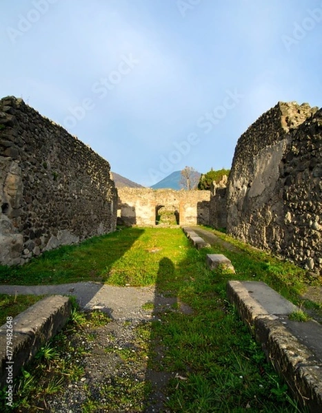Fototapeta Ancient ruins, long shadows, clear sky