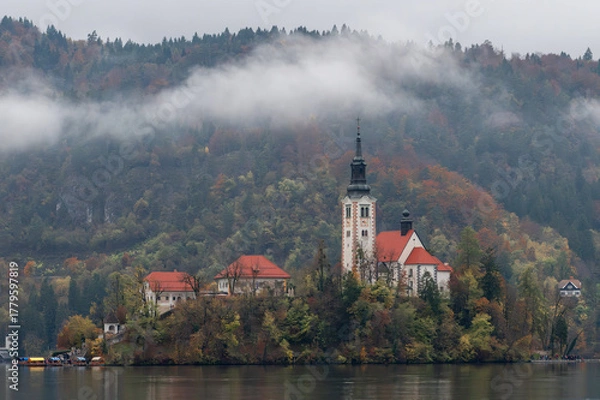 Obraz Autumn at lake bled with scenic church island in slovenia during a cloudy day