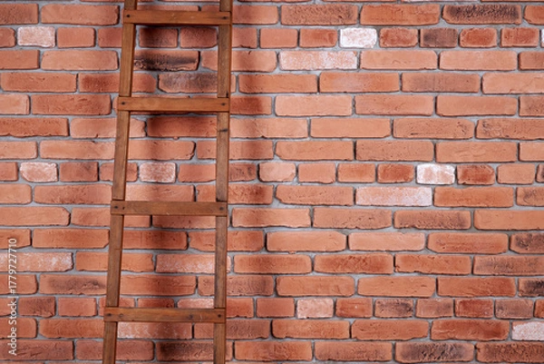 Fototapeta Brick wall and wooden stairs, background for design. Red old brick