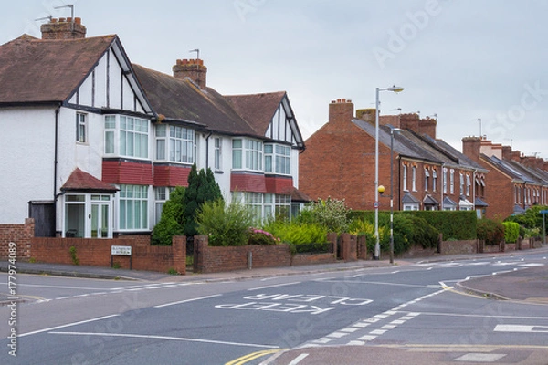 Fototapeta A quiet street in Alphington. Mainly cloudy. Exeter. Devon