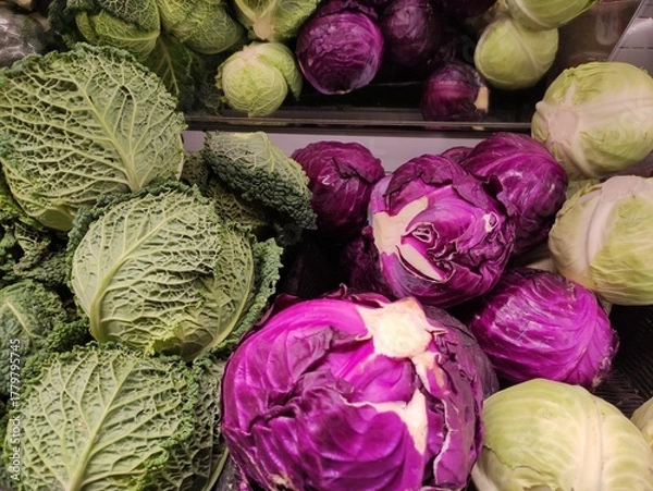 Fototapeta Fresh green and purple cabbages arranged in a vibrant display, showcasing their textured leaves and rich colors, emphasizing healthy eating and organic produce options